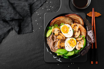 Traditional Japanese soup ramen with meat broth, asian noodles, sliced pork and eggs . Asian style food.