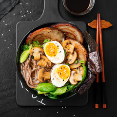 Traditional Japanese soup ramen with meat broth, asian noodles, sliced pork and eggs . Asian style food.