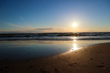 Fototapeta na wymiar Beautiful sunset on the Baltic sea beach, Palanga, Lithuania
