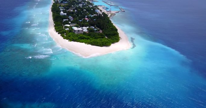 long palm tree island beach and clear blue water, Dominican Republic