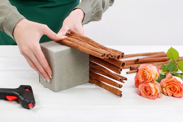 How to make floral arrangement with roses and cinnamon sticks