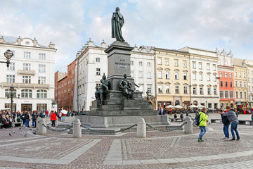 Fototapeta premium KRAKOW, POLAND - SEPTEMBER 18, 2019: Statue of Adam Mickiewicz at the Main Market Square