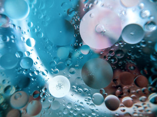 Abstract image of oil and water on a colorful surface