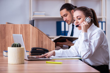 Call center operators working in the office