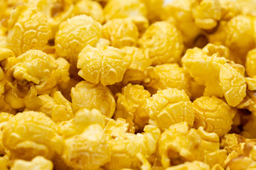 Butter caramel popcorn in wooden bowl bulk on white background, Popular snack with favorite movie
