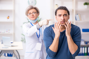 Young patient visiting doctor in hospital