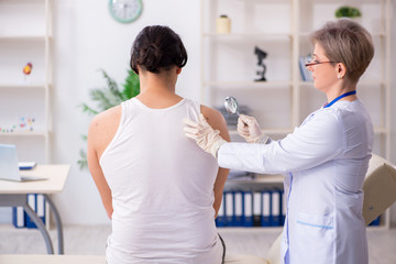 Fototapeta premium Young patient visiting doctor in hospital