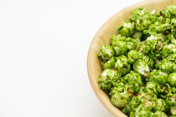 Top view the lush of Japanese matcha green tea popcorn with white background for copy space text, Popular snack with favorite movie