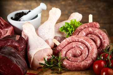 Rolled kringelwurst with raw chicken legs