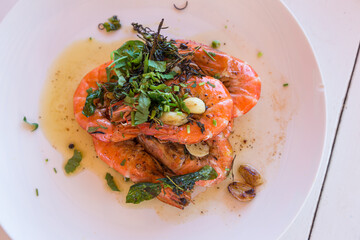 Thai food - spicy Shrimp salad with garlic and basil
