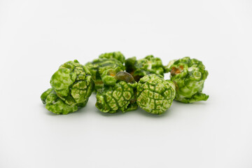 Lush of Japanese matcha green tea popcorn isolated on white background, Popular snack with favorite movie