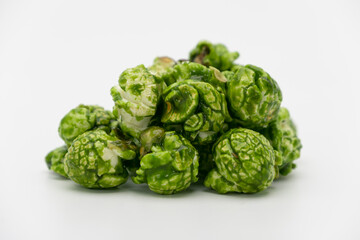 Lush of Japanese matcha green tea popcorn isolated on white background, Popular snack with favorite movie
