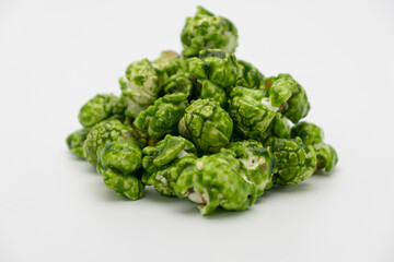 Lush of Japanese matcha green tea popcorn isolated on white background, Popular snack with favorite movie
