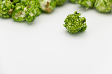 Lush of Japanese matcha green tea popcorn isolated on white background, Popular snack with favorite movie