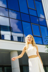 Cheerful fashionable woman in city