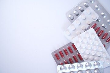 Assorted pills in blister pack with copyspace. Pharmaceutical concept background image.