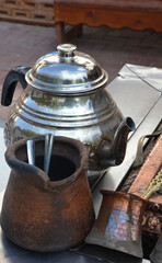 old teapot and coffee pot on wooden table