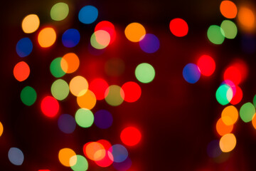 Obraz premium Blurring background for a holiday greeting card, banner advertising. Shimmering bokeh, lights of the city.