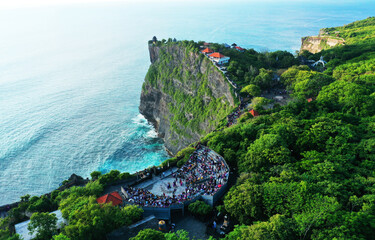 Rock and sea, view of Kecak Dance performace and Uluwatu Temple.
