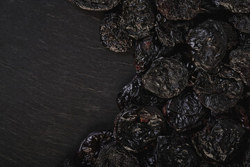 texture of prunes close-up on black
