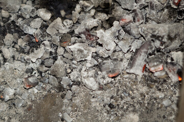 Ashes and coal from a fire in the stove