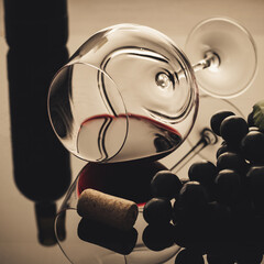 lying vineglass with red grapevine