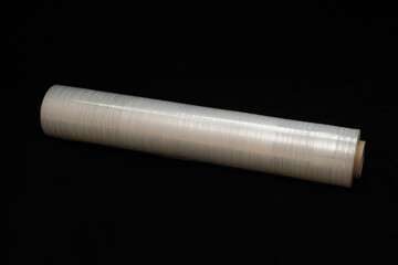 Roll of stretch film on a black background