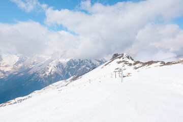 ski resort in the Caucasus mountains Sunny day in winter, snow slopes,