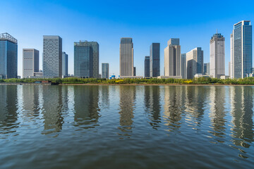 Fototapeta premium Business district office buildings and water reflection in Beijing .