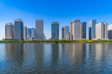Business district office buildings and water reflection in Beijing .