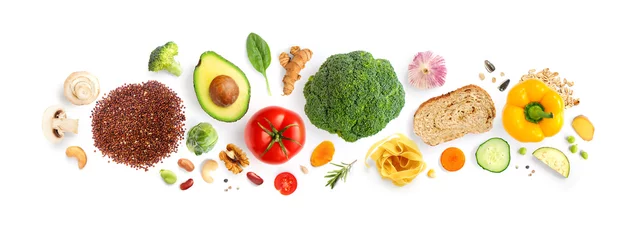 Wall murals Fresh vegetables Creative layout made of walnuts, cashew, avocado, tomato, broccoli, bread, pasta, pepper, curcuma, rice and garlic on white background. Flat lay. Food concept. Macro concept.