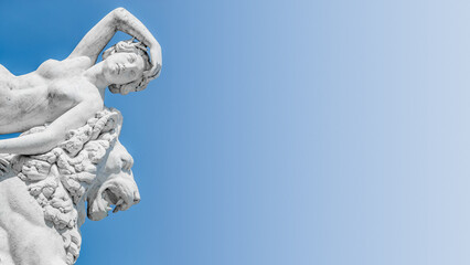 Ancient statue sensual renaissance era woman laying on big lion in Potsdam, Germany