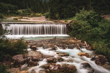 Waterfall in the mountains in autumn, Sexten creek