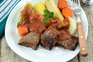 plate of pot au feu (french cuisine) on a table