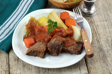 plate of pot au feu (french cuisine) on a table