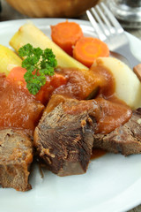 plate of pot au feu (french cuisine) on a table