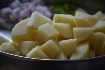 slices of potato in a plate in kitchen, Indian Food