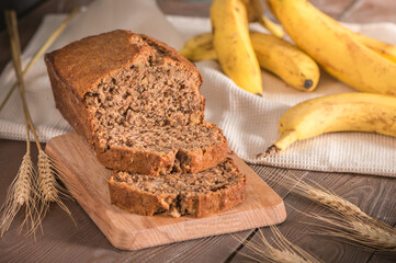 Fresh banana bread on rustic background