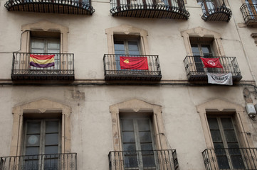 Balconies with flags. Huesca. Aragon. Spain.