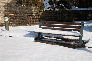 Park bench covered with snow. Sabiñanigo. Huesca. Aragon. Spain.