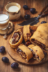 Homemade plum roll cake, strudel with plum filling.
