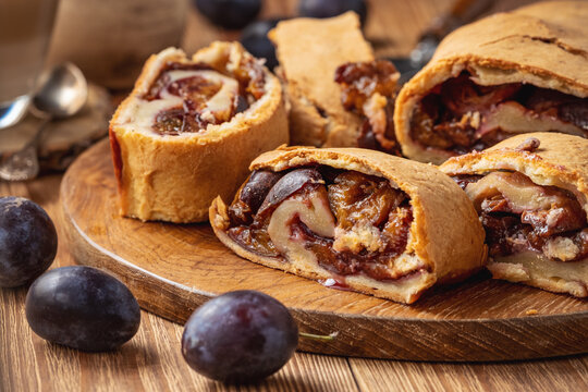 Homemade plum roll cake, strudel with plum filling.