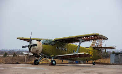 Old military airplane biplane on airfield of airport