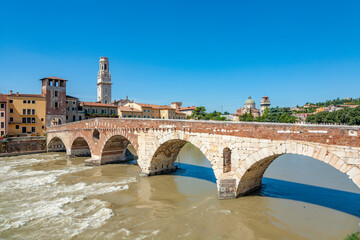 the old roman bridge Ponte di Pietra in Verona  spans the river Etsch