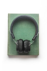 book with headphones. Audiobook concept