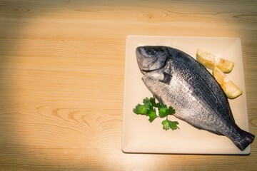 fresh fish with lemon and parsley