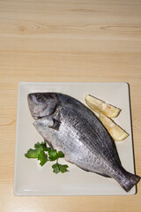fresh fish with lemon and parsley