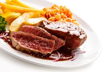 Grilled steak with french fries on white background