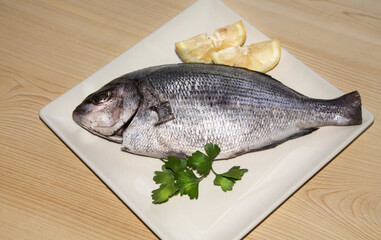 fresh fish with lemon and parsley