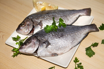 fresh fish with lemon and parsley